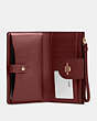 COACH®,PHONE WALLET,Leather,Gold/Cranberry,Inside View,Top View