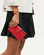 COACH®,PHONE WALLET,Leather,Gold/Electric Red,Detail View