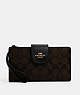 COACH®,PHONE WALLET IN COLORBLOCK SIGNATURE CANVAS,pvc,Medium,Gold/Brown Black,Front View
