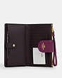 COACH®,PHONE WALLET IN COLORBLOCK SIGNATURE CANVAS,pvc,Gold/Khaki/Deep Berry,Inside View,Top View
