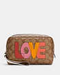 COACH®,BOXY COSMETIC CASE IN SIGNATURE CANVAS WITH LOVE PRINT,Gold/Khaki Chalk Multi,Front View