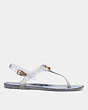 COACH®,NATALEE JELLY SANDAL,Rubber,Silver,Angle View
