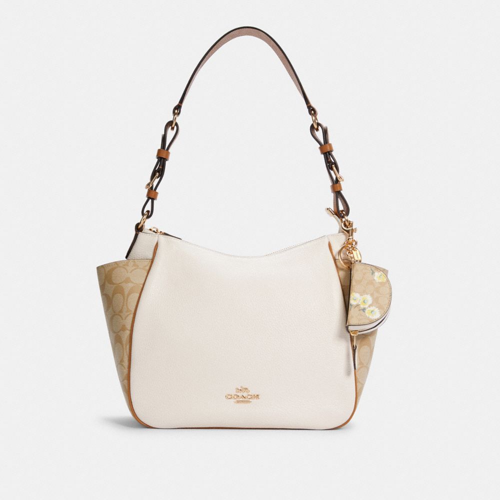 Breloque de pochette avec croissant en toile Signature avec motif de marguerite