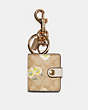 COACH®,PICTURE FRAME BAG CHARM IN SIGNATURE CANVAS WITH DAISY PRINT,pvc,Gold/Light Khaki Yellow,Front View