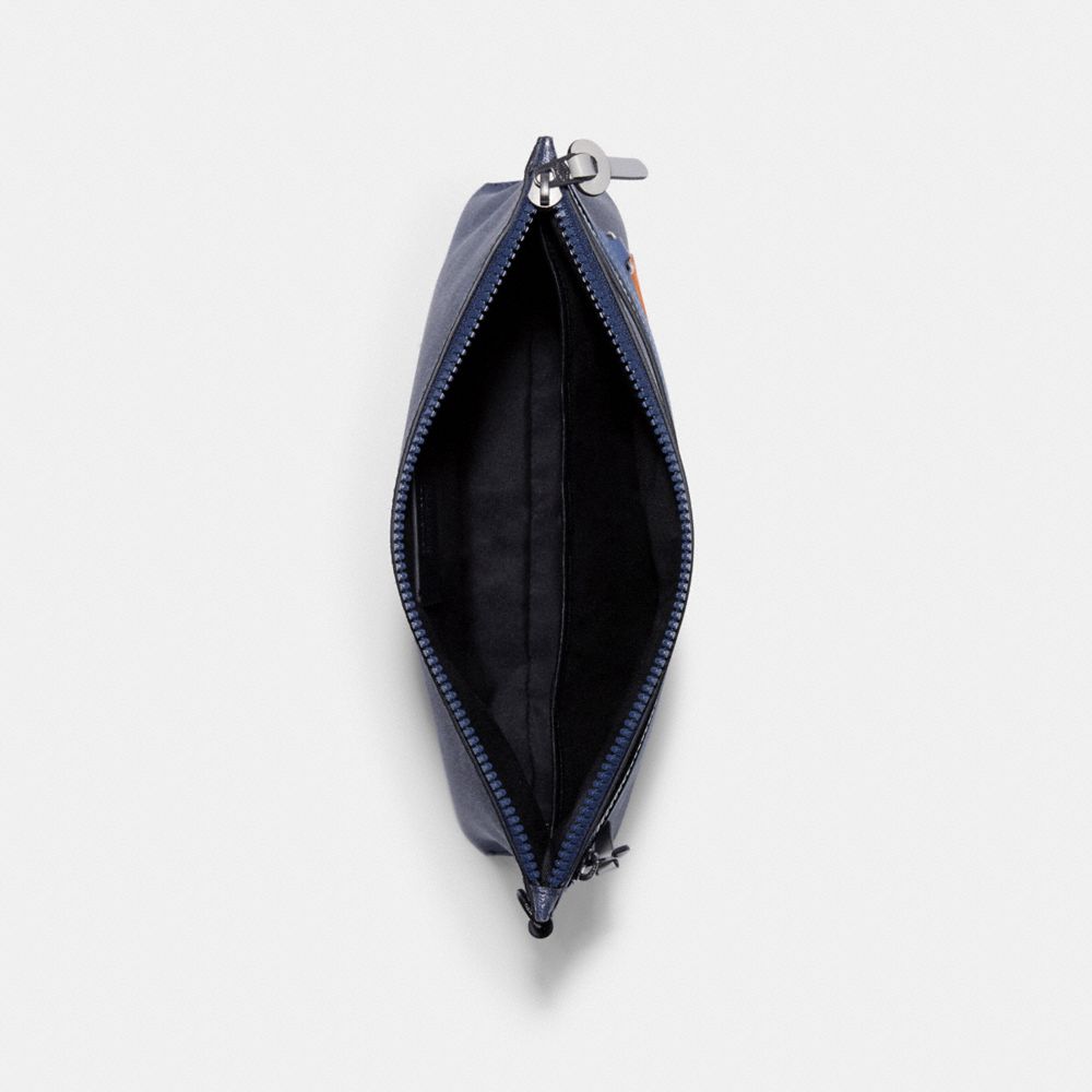 Carryall pouch discount in signature canvas