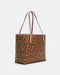 COACH®,CITY TOTE IN SIGNATURE CANVAS WITH HEART FLORAL PRINT,Large,Gold/Khaki Red Multi Wine,Angle View