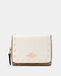 COACH®,SMALL TRIFOLD WALLET IN SIGNATURE CANVAS WITH RIVETS,pvc,Mini,Gold/Light Khaki Multi,Front View