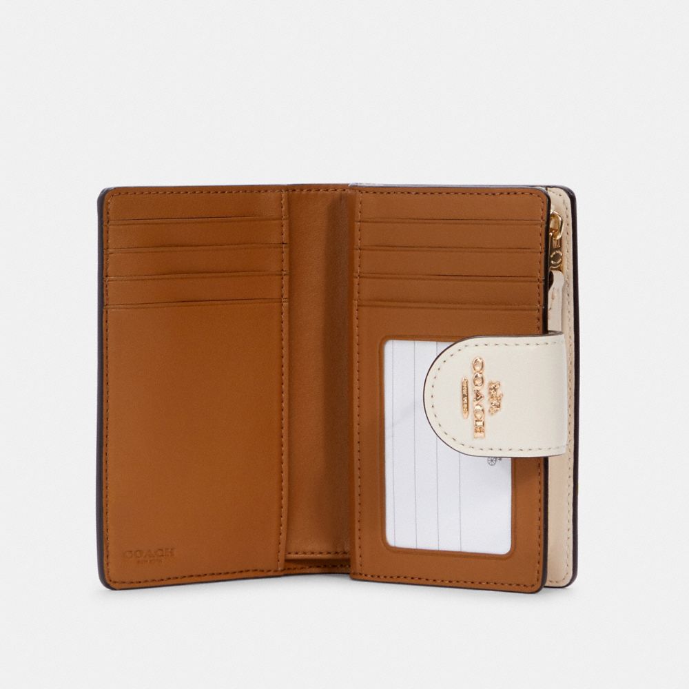 Medium Corner Zip Wallet In Signature Canvas With Daisy Print