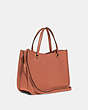 COACH®,TYLER CARRYALL 28,Pebbled Leather,Medium,Brass/Light Coral,Angle View
