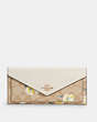 COACH®,SLIM ENVELOPE WALLET IN SIGNATURE CANVAS WITH DAISY PRINT,pvc,Gold/Light Khaki Chalk Multi,Front View