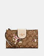 COACH®,PHONE WALLET IN SIGNATURE CANVAS WITH EVERGREEN FLORAL PRINT,Gold/Khaki Multi,Front View