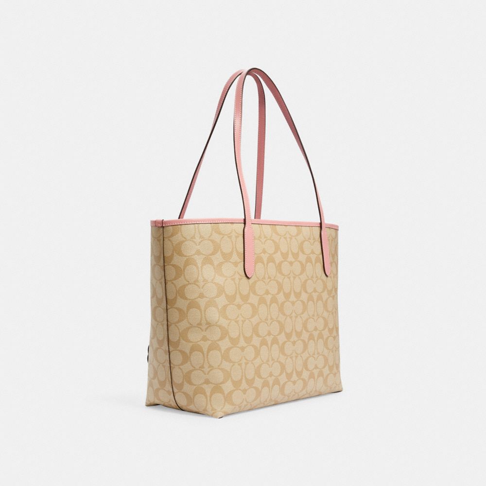 COACH®,Disney X Coach City Tote Bag In Signature Canvas With Patches,,Angle View