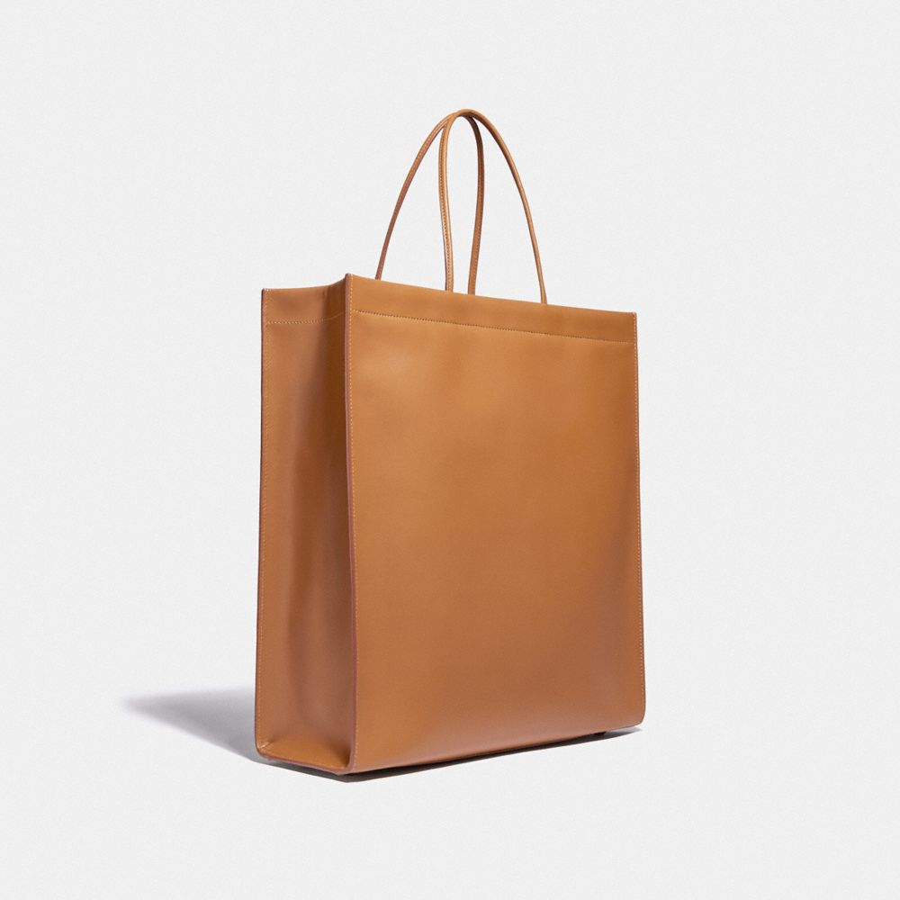 COACH®,A LOVE LETTER TO NEW YORK CASHIN CARRY SHOPPER TOTE 36,Smooth Leather,Large,Brass/Light Saddle,Angle View