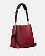 COACH®,WILLOW BUCKET BAG IN COLORBLOCK,Refined Pebble Leather,Medium,Brass/Cherry,Angle View