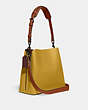 COACH®,WILLOW BUCKET BAG IN COLORBLOCK,Refined Pebble Leather,Medium,Pewter/Flax,Angle View