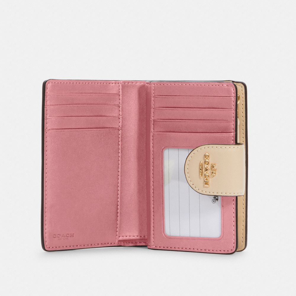 COACH Medium Corner Zip Wallet in Pink
