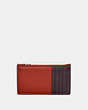 COACH®,ZIP CARD CASE IN COLORBLOCK,Smooth Leather,Red Sand/Oxblood,Back View