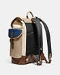 COACH®,HITCH BACKPACK IN ORGANIC COTTON CANVAS,Organic Cotton Canvas,Large,Black Copper/Natural Multi,Angle View