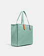COACH®,TOTE 42 IN 100 PERCENT RECYCLED CANVAS,Recycled Canvas,Large,Brass/Iceberg Green,Angle View