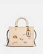 COACH®,ROGUE BAG 25 WITH EMBROIDERY,Natural Pebble Leather,Medium,Brass/Ivory,Front View