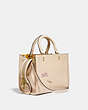 COACH®,ROGUE BAG 25 WITH EMBROIDERY,Natural Pebble Leather,Medium,Brass/Ivory,Angle View