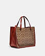 COACH®,TYLER CARRYALL 28 IN SIGNATURE CANVAS,Signature Coated Canvas,Medium,Brass/Tan/Rust,Angle View