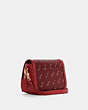 COACH®,SADDLE BAG WITH HORSE AND CARRIAGE DOT PRINT,Small,Gold/1941 Red,Angle View