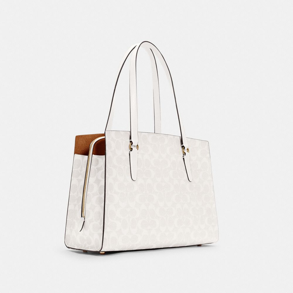 COACH®,TATUM CARRYALL 40 IN SIGNATURE CANVAS,Signature Canvas,X-Large,Gold/Chalk/Glacierwhite,Angle View