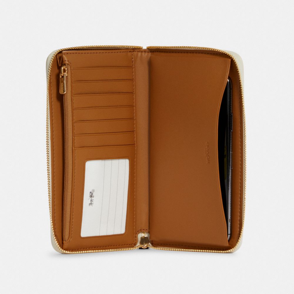 COACH®,Dempsey Large Phone Wallet In Signature Jacquard With Stripe And Coach Patch,,Inside View,Top View