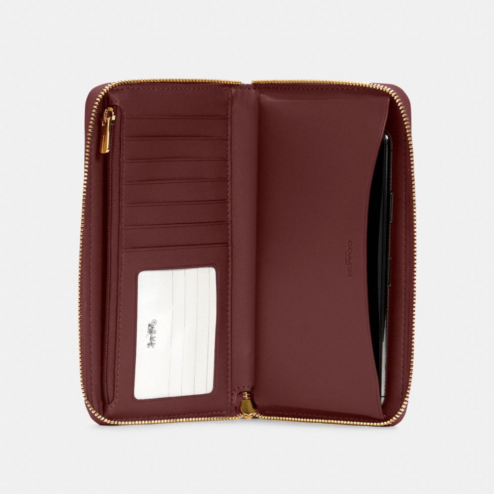 Dempsey Large Phone Wallet In Signature Jacquard With Stripe And Coach Patch