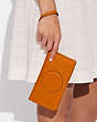 COACH®,DEMPSEY LARGE PHONE WALLET,Pebbled Leather,Im/Light Orange,Detail View