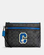 Coach X Peanuts Carryall Pouch In Signature Canvas With Snoopy