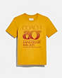 COACH®,COACH 80th ANNIVERSARY T-SHIRT IN ORGANIC COTTON,cotton,MUSTARD,Front View