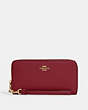 COACH®,LONG ZIP AROUND WALLET,Pebbled Leather,Mini,Gold/Cherry,Front View