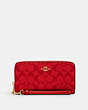COACH®,LONG ZIP AROUND WALLET IN SIGNATURE CANVAS,pvc,Mini,Im/Miami Red,Front View