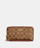 COACH®,LONG ZIP AROUND WALLET IN SIGNATURE CANVAS,pvc,Gold/Khaki Redwood,Front View
