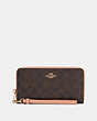 COACH®,LONG ZIP AROUND WALLET IN SIGNATURE CANVAS,pvc,Mini,Gold/Light Khaki/Faded Blush,Front View