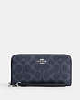 COACH®,LONG ZIP AROUND WALLET IN SIGNATURE CANVAS,pvc,Small,Silver/Denim/Midnight Navy,Front View