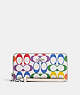 COACH®,LONG ZIP AROUND WALLET IN RAINBOW SIGNATURE CANVAS,pvc,Mini,Silver/Chalk Multi,Front View