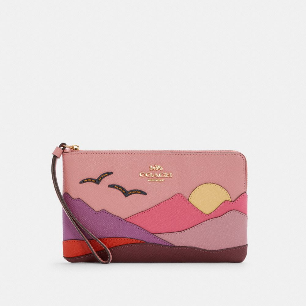 Pink best sale coach wristlet