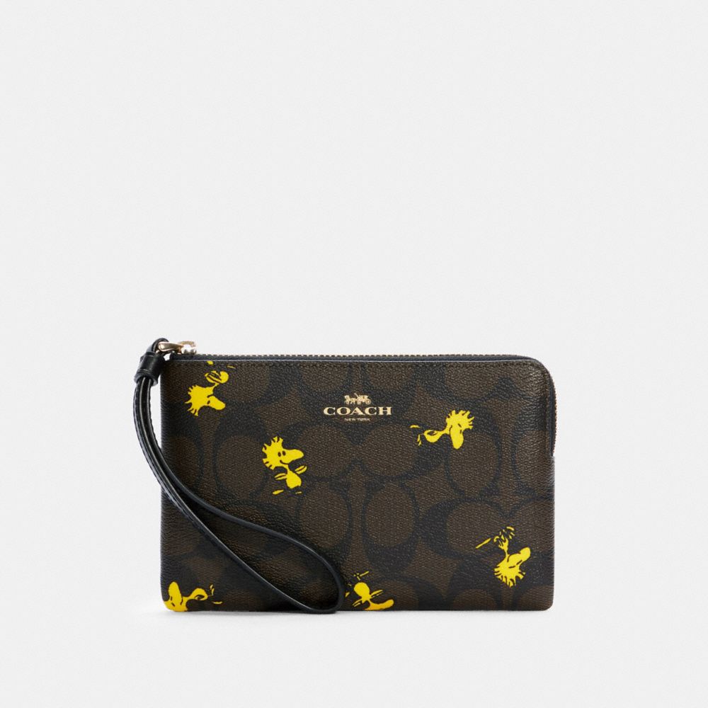 COACH®,COACH X PEANUTS CORNER ZIP WRISTLET IN SIGNATURE CANVAS WITH WOODSTOCK PRINT,pvc,Mini,Gold/Brown Black Multi,Front View