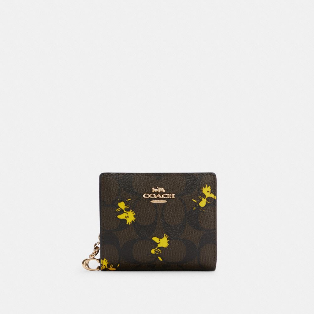 Coach X Peanuts Snap Wallet In Signature Canvas With Woodstock Print