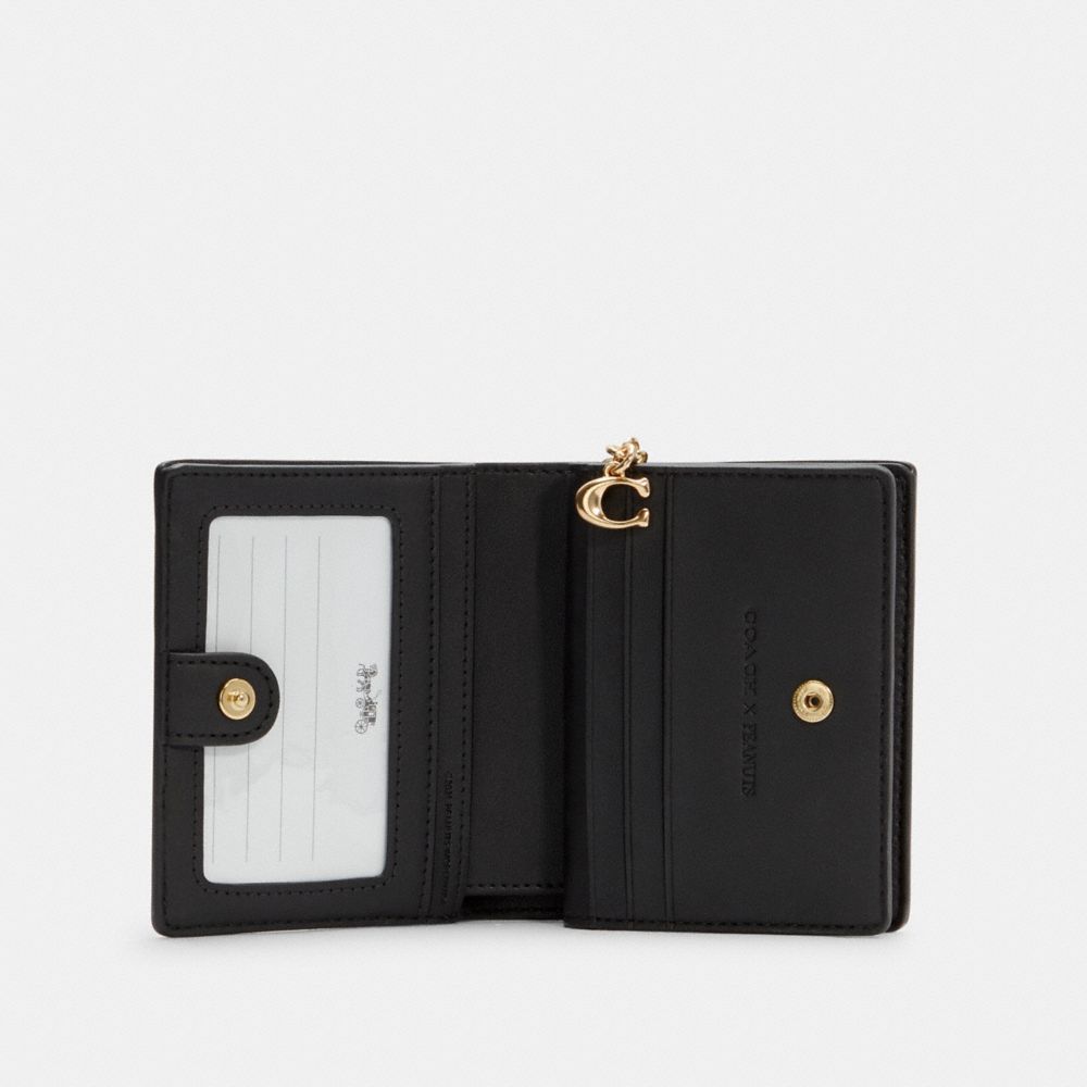 COACH®,Coach X Peanuts Snap Wallet In Signature Canvas With Woodstock Print,,Inside View,Top View