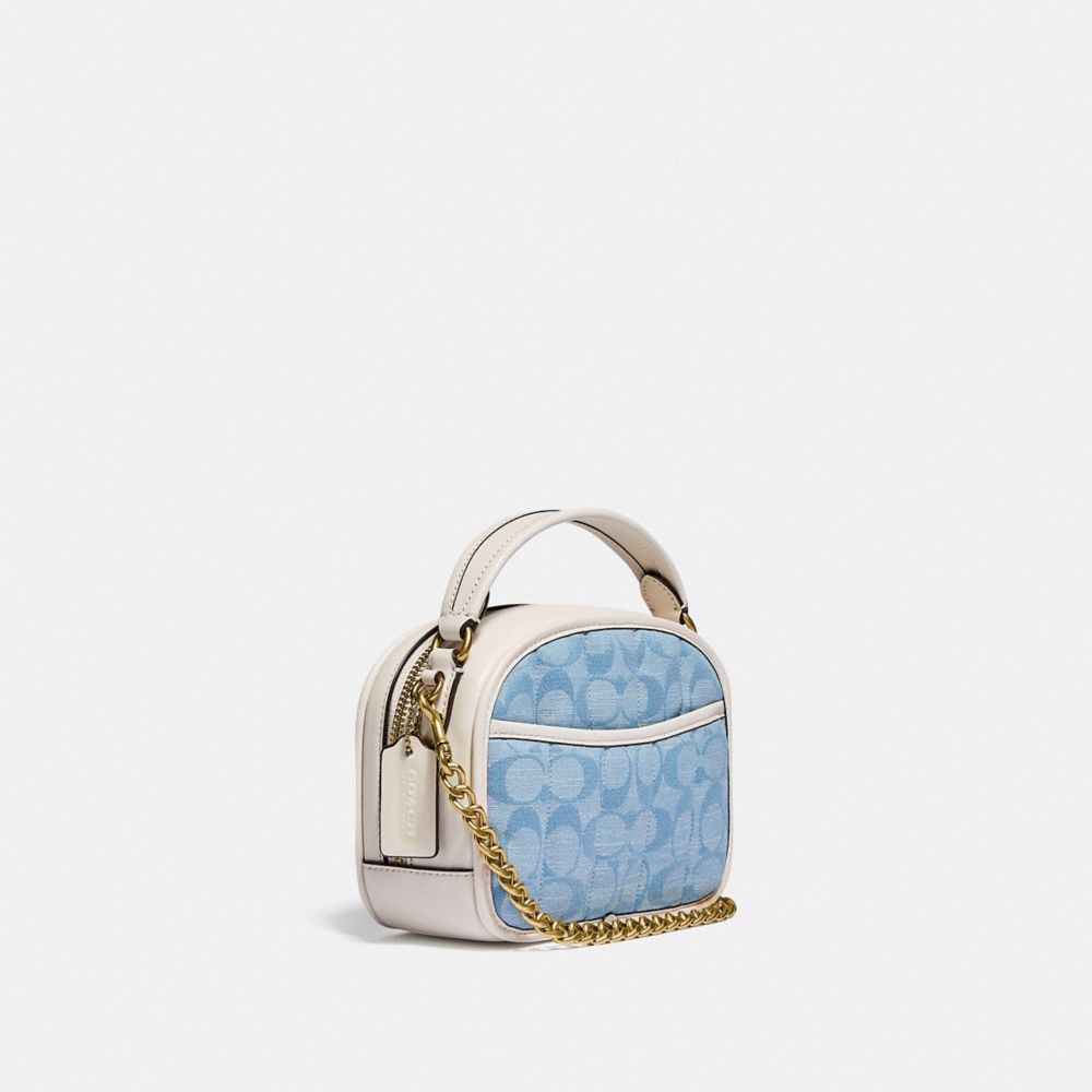 COACH®,LUNCHBOX TOP HANDLE IN SIGNATURE CHAMBRAY WITH QUILTING,Signature chambray,Small,Brass/Light Washed Denim Chalk,Angle View