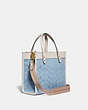 COACH®,FIELD TOTE 22 IN SIGNATURE CHAMBRAY,Signature chambray,Medium,Brass/Light Washed Denim Chalk,Angle View