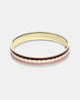 COACH®,SIGNATURE BANGLE,Enamel/Plated Brass,Gold/Red Sand/Chalk,Front View