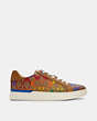 COACH®,CLIP LOW TOP SNEAKER IN RAINBOW SIGNATURE CANVAS,n/a,Rainbow Signature,Angle View