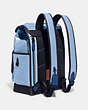 COACH®,LEAGUE FLAP BACKPACK IN COLORBLOCK,Refined Calf Leather,X-Large,Pobrass/Midnight Navy,Angle View