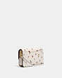 COACH®,HAYDEN CROSSBODY WITH PAINT DAB FLORAL PRINT,Pebble Leather/Smooth Leather,Mini,Brass/Chalk Multi,Angle View
