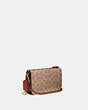 COACH®,NOA POP-UP MESSENGER IN SIGNATURE CANVAS,Signature Coated Canvas/Smooth Leather,Mini,Brass/Tan/Rust,Angle View